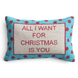 Cotton lumbar pillow with red embroidered “All I Want for Christmas Is You” lettering and a turquoise border with red polka dots.