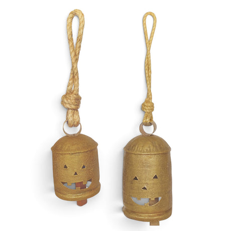 Antique gold metal Halloween bells with jack-o’-lantern cutouts and jute hangers in two sizes