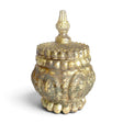 Embossed mercury glass container in an antique silver finish with a rounded body and matching finial lid shown beside it.