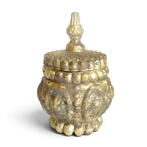 Embossed mercury glass container in an antique silver finish with a rounded body and matching finial lid shown beside it.