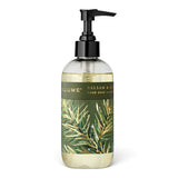  ILLUME Balsam & Cedar hand soap in a clear 8 fl oz bottle with a black pump and green botanical label with gold accents