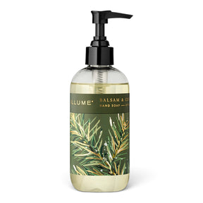  ILLUME Balsam & Cedar hand soap in a clear 8 fl oz bottle with a black pump and green botanical label with gold accents