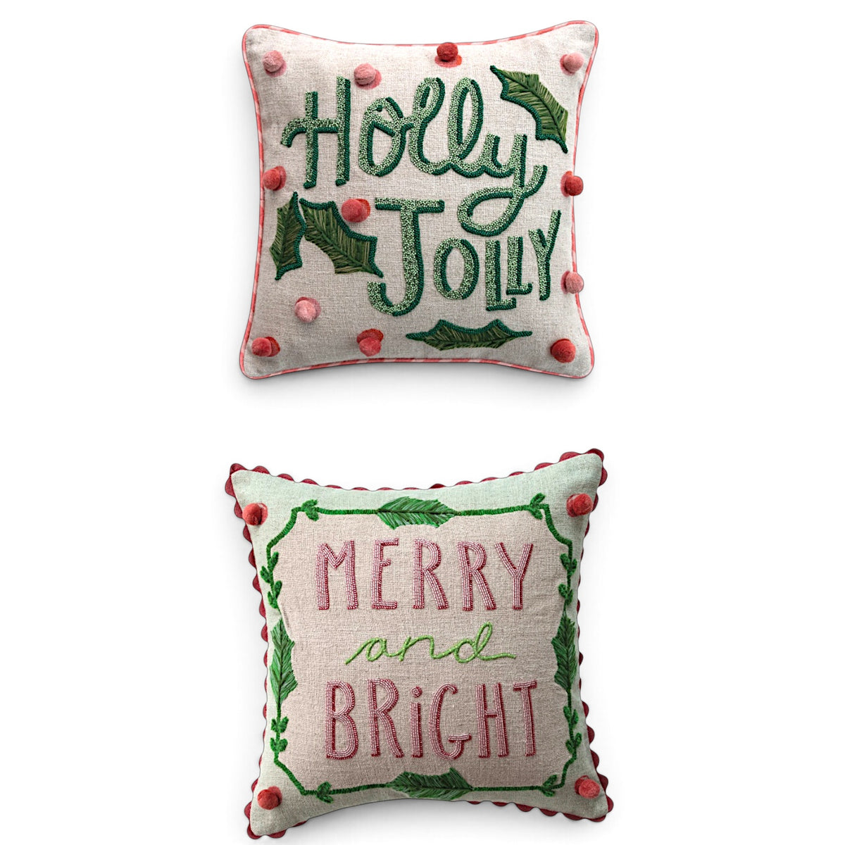 Holly Jolly and Merry and Bright square linen pillows with beaded lettering, embroidered green leaves, and red and pink pompoms