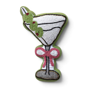 Martini-shaped beaded pillow with three green olives, a pink bow, white and silver glass details, and green fabric edging