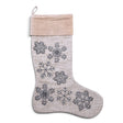 Neutral cotton slub Christmas stocking with blue-gray embroidered and beaded snowflakes, a pale velvet cuff, and a hanging loop