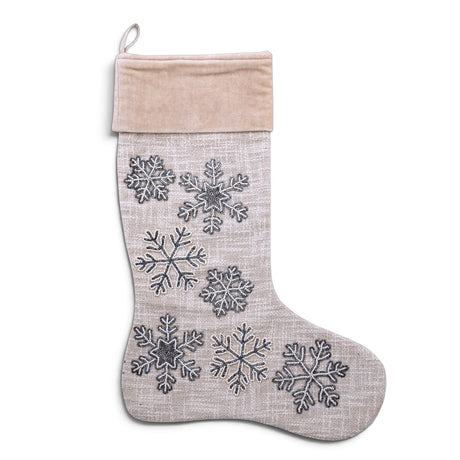 Neutral cotton slub Christmas stocking with blue-gray embroidered and beaded snowflakes, a pale velvet cuff, and a hanging loop