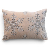 Taupe cotton velvet lumbar pillow with large embroidered snowflakes, white stitching, and silver-toned bead detailing