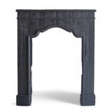 Black wooden mantle with open center for decor or storage, styled for holiday display