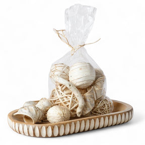 Assorted bleached wood decorative bowl filler packaged in clear bag