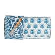 Blue and white block print stoneware tray with matching cotton towel and bamboo-handled spreader.