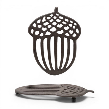 Cast iron acorn shaped trivet with openwork woodland design