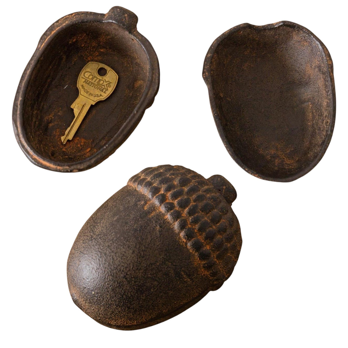 Cast iron acorn-shaped trinket box with a rustic finish, ideal for small storage.