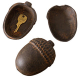 Cast iron acorn-shaped trinket box with a rustic finish, ideal for small storage.