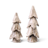 Cream ceramic Christmas trees with tiered, draping branches, sculpted grooves, and a speckled reactive glaze with brown accents.