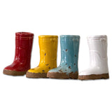 Set of four mini ceramic boot vases in red, yellow, blue, and white with a distressed finish.