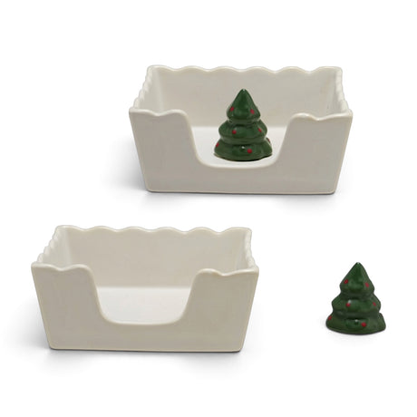 Cream ceramic cocktail napkin holder with a scalloped rim and removable green Christmas tree weight with red accents
