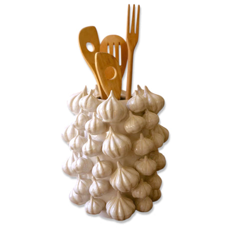 Ceramic vase designed with sculpted garlic bulbs, ideal for kitchen decor or utensil storage.