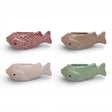 Ceramic fish vase magnet holding small flowers on refrigerator