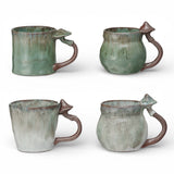Reactive glaze ceramic coffee mug with mushroom shaped handle