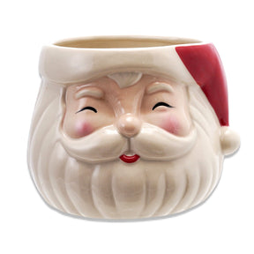 Red and white ceramic Santa head planter with rosy cheeks, smiling eyes, and a sculpted beard, sized to hold a 5-inch pot.