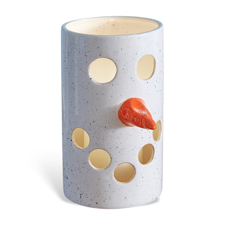 Ceramic snowman luminary with cutout face and carrot nose for tea light or LED candle