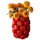 Ceramic vase designed with sculpted red tomatoes, ideal for kitchen or floral display.