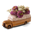 Yellow ceramic school bus planter filled with flowers, perfect for teacher or bus driver gifts