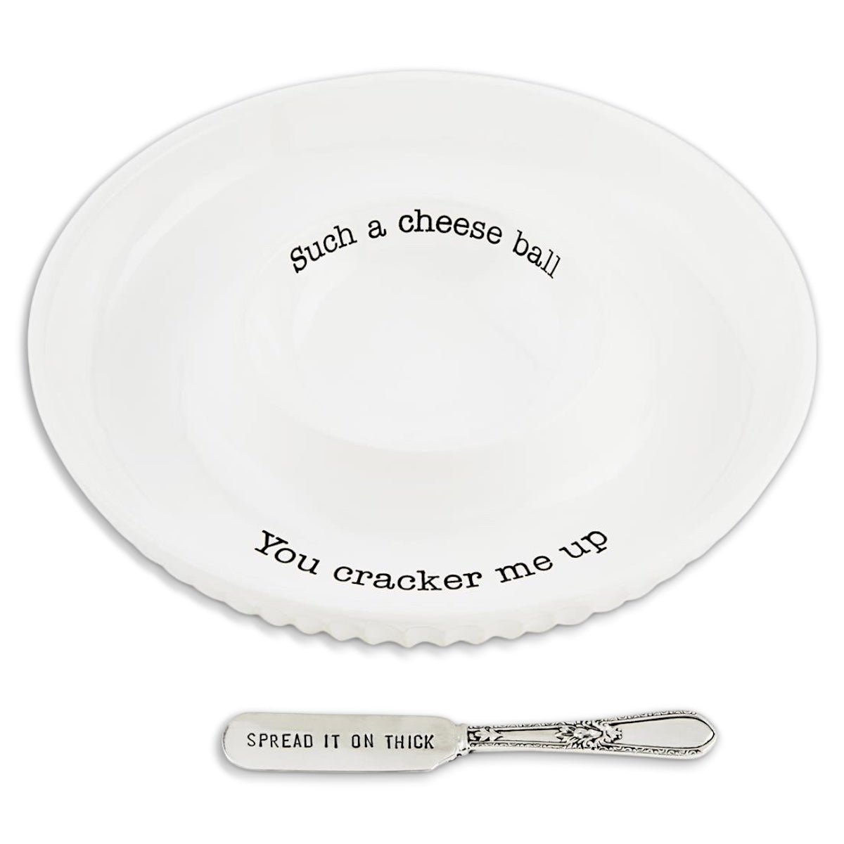 White ceramic cheese ball dish with funny text and a silver spreader that says Spread it on thick