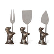 Set of three stainless steel cheese knives with dog-shaped stands in antique silver and brass finish.