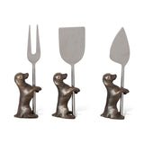 Set of three stainless steel cheese knives with dog-shaped stands in antique silver and brass finish.