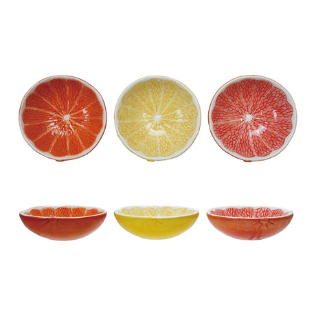 Set of three ceramic citrus fruit-shaped bowls in orange, yellow, and red with intricate detailing.