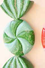 Colorful Christmas candy ornament with curved ribbon ends