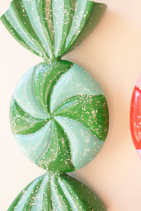 Colorful Christmas candy ornament with curved ribbon ends