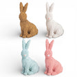 hand painted wicker style resin bunny decor in pastel colors for spring and easter styling