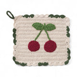8-inch crocheted cotton pot holder with red cherry design and green scalloped trim