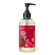 ILLUME Cranberry Currant hand soap in a clear 8 fl oz bottle with a black pump and red botanical label with gold accents