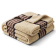 Cream faux sherpa throw blanket with black and grey stripes and a soft textured surface