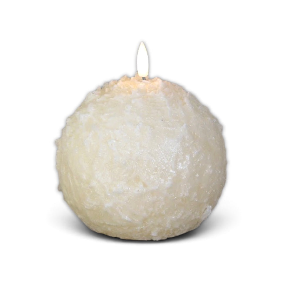 Cream shimmer snowball candle with a rounded body and 3D flame for winter and Christmas decor.