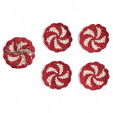 Set of 4 red and natural crocheted candy swirl coasters with scalloped edges tied in jute