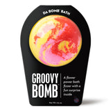 Da Bomb Groovy Bomb yellow bath fizzer with pink and red swirls, Flower Power fragrance and a surprise inside