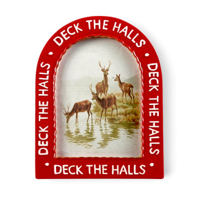 Red arched ceramic photo frame with raised white Deck the Halls lettering and a wavy gold-toned inner border surrounding a deer illustration