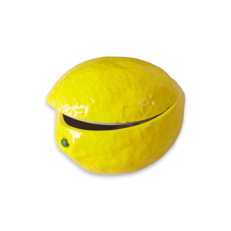 Lemon-shaped ceramic dish with a removable lid, glossy finish, and realistic texture.