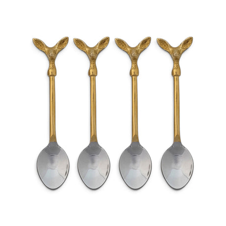  Four coffee spoons with gold-toned deer head handles and silver-toned bowls beside a cream printed drawstring bag