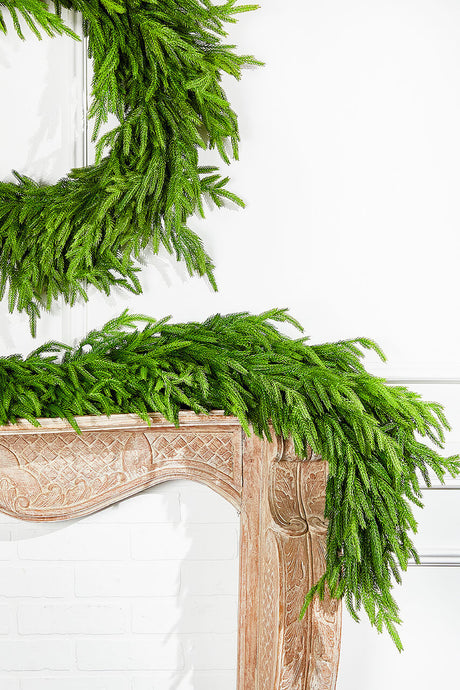 close up showing detail of lifelike norfolk pine garland