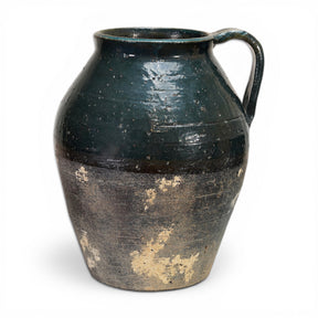 distressed terra cotta pitcher vase with reactive glaze and blue undertones