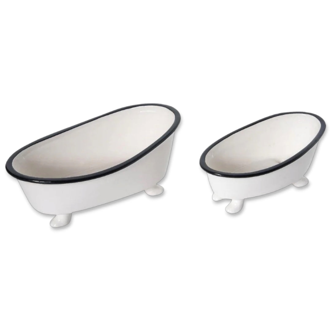 White enamel washtub planter with black rim and clawfoot design