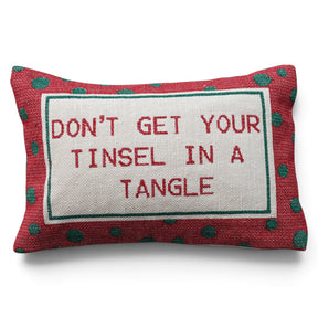 Cotton lumbar pillow with red embroidered “Don’t Get Your Tinsel in a Tangle” lettering and a red border with green polka dots.