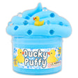 Blue butter slime with duck charms and boba toppers in container