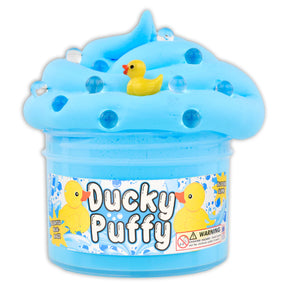 Blue butter slime with duck charms and boba toppers in container
