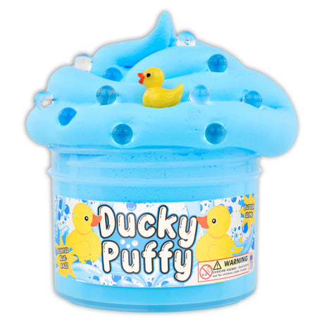 Blue butter slime with duck charms and boba toppers in container